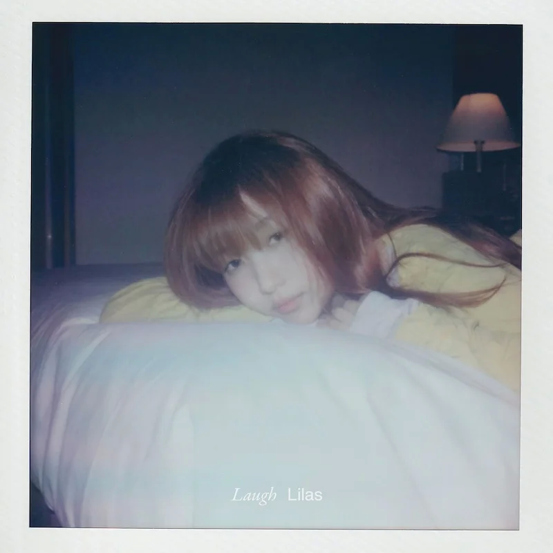 Ikuta Lilas on a bed