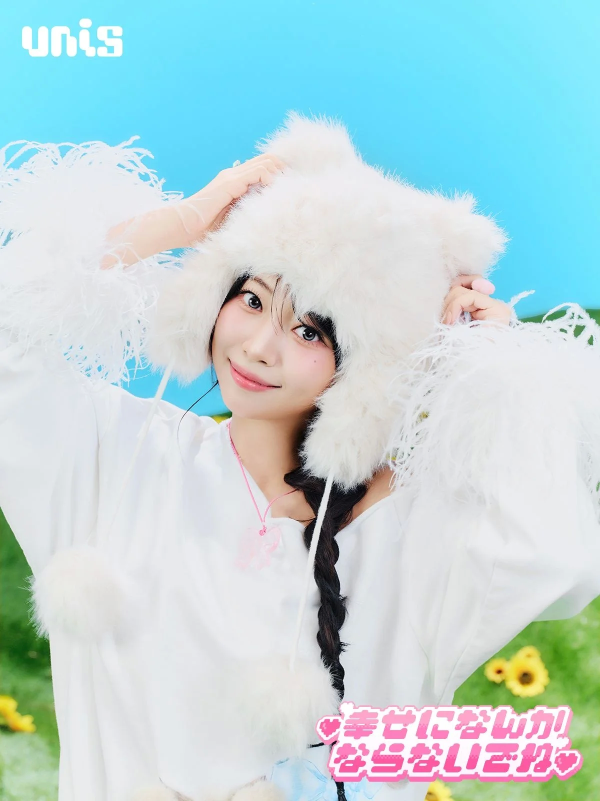 A young woman with long dark braided hair wearing a fluffy white hat against a blue sky background