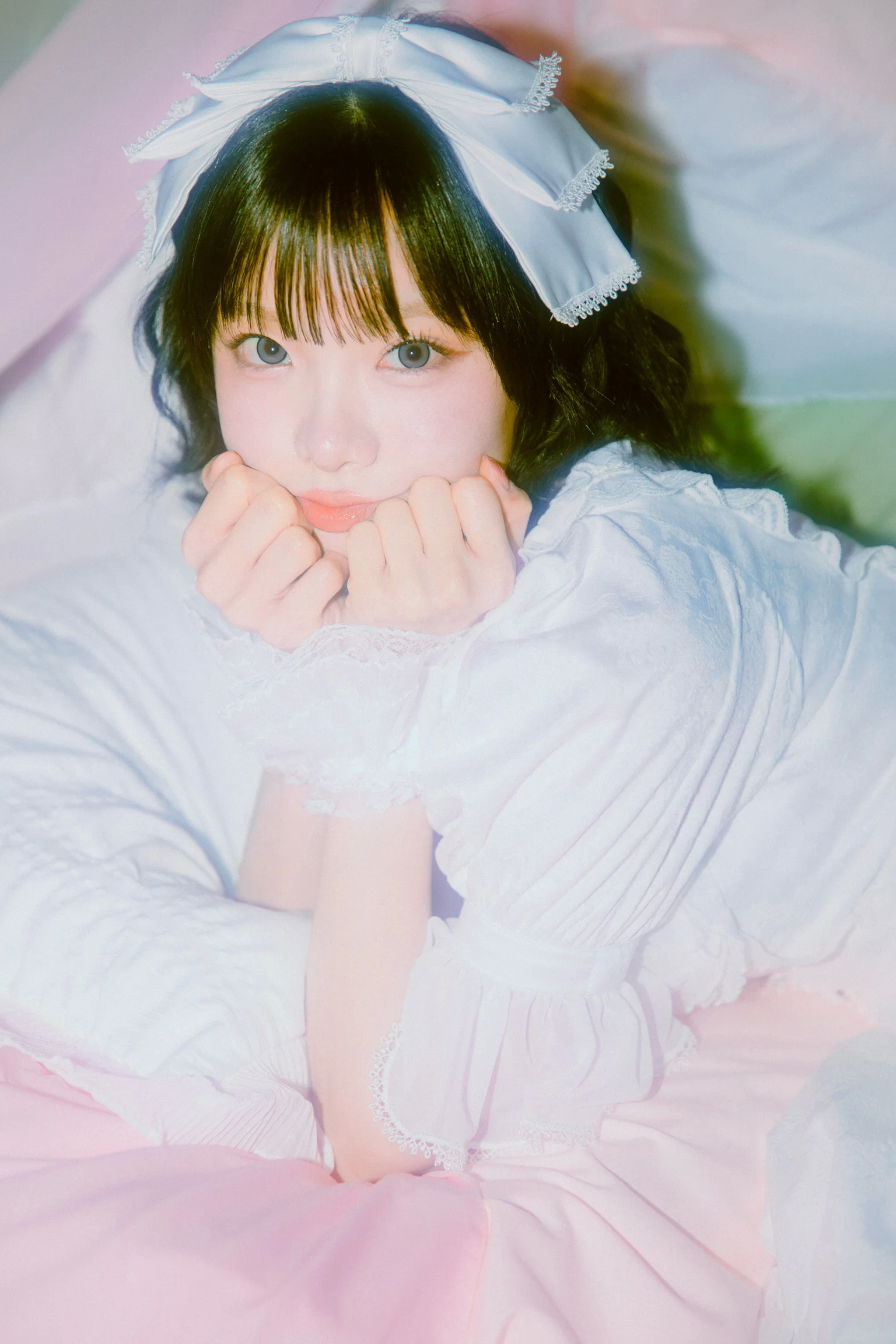 A SugarNote member in a white dress