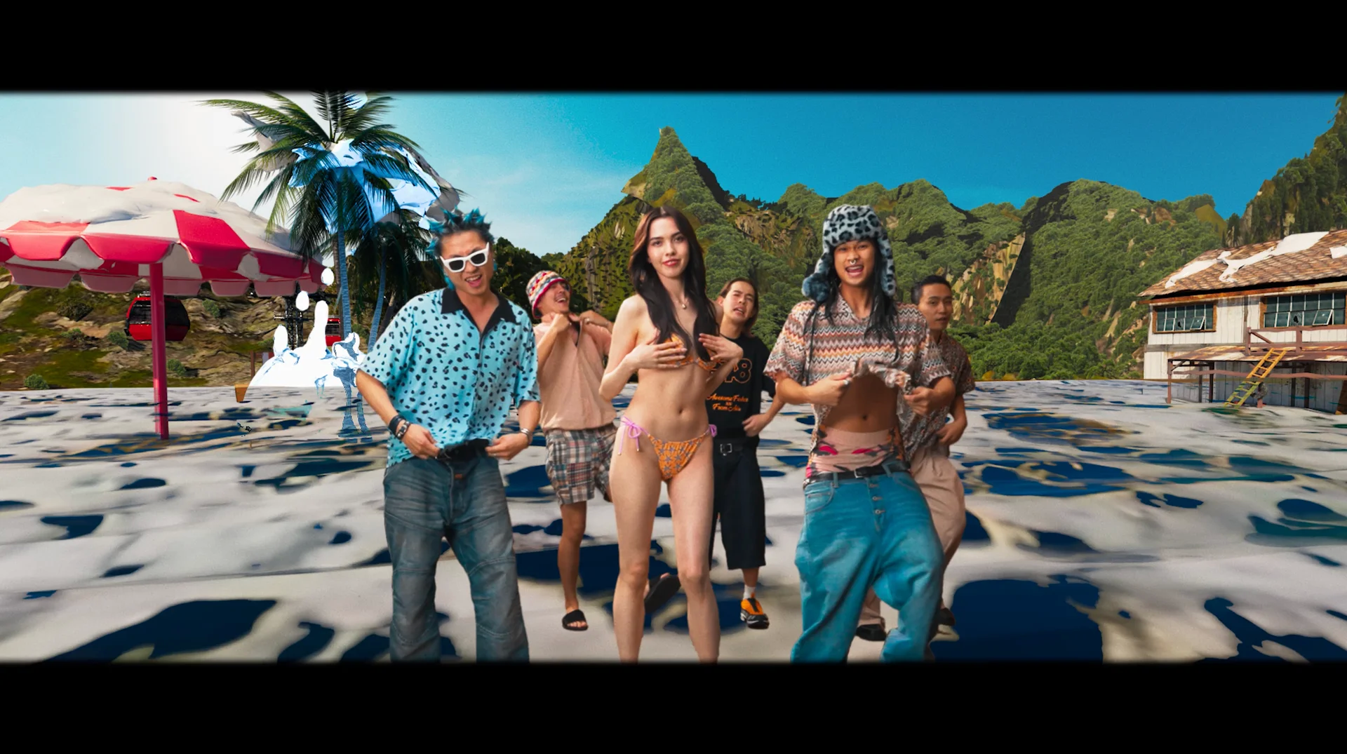 A csapat úszódresszben táncol egy trópusi CG háttér előtt