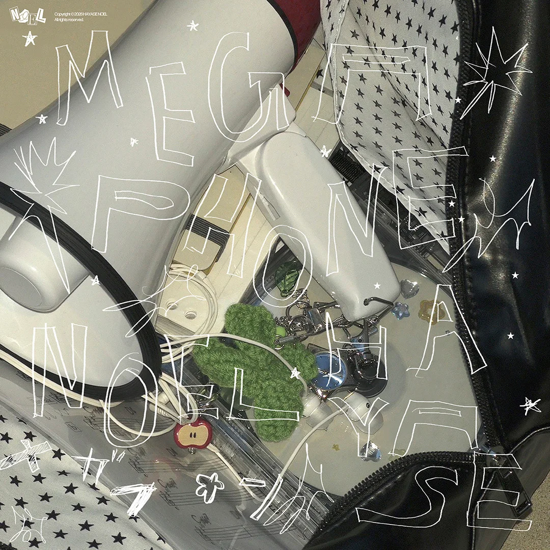 A megaphone inside a star-patterned bag with the text MEGA PHONE NOEL HAYASE