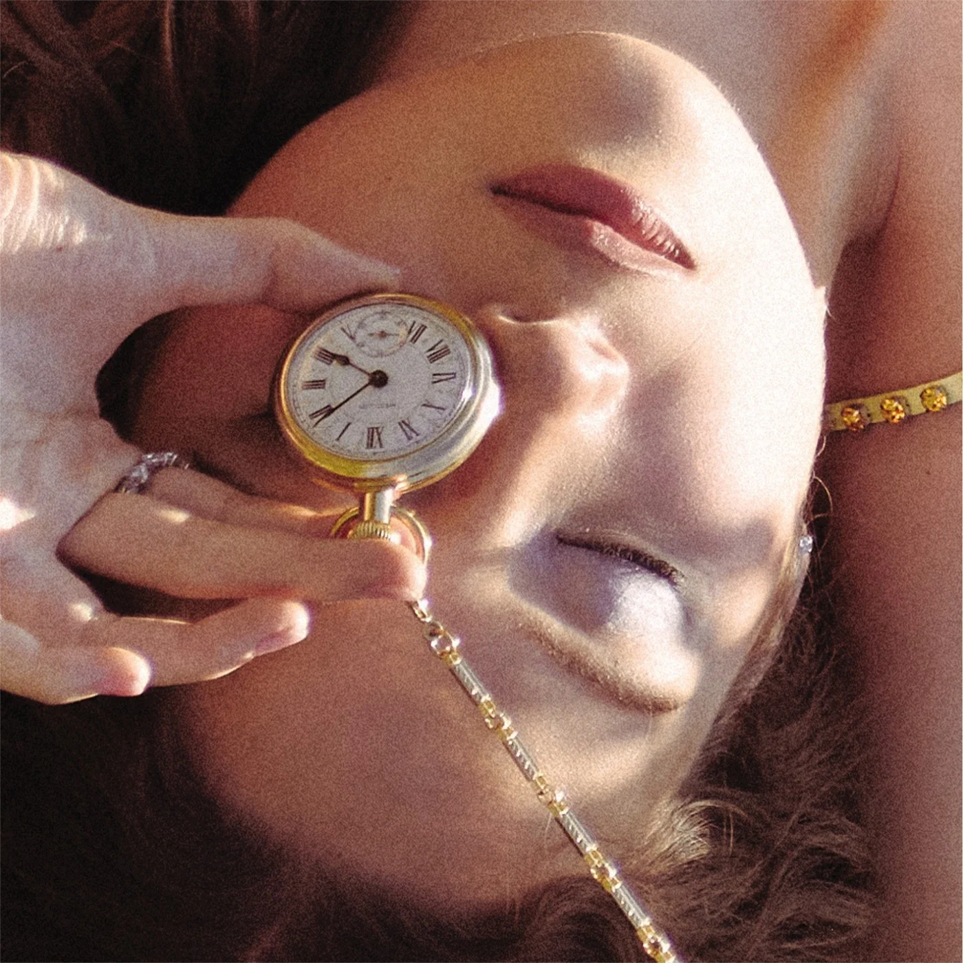 Close-up of a person holding a pocket watch