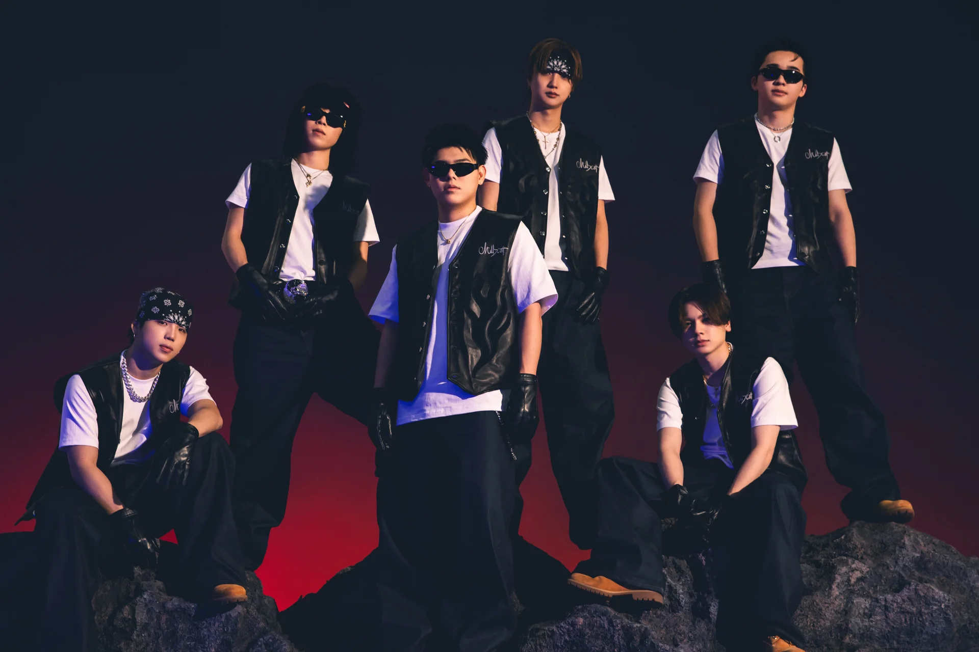 BE:FIRST posing in black vests and white shirts