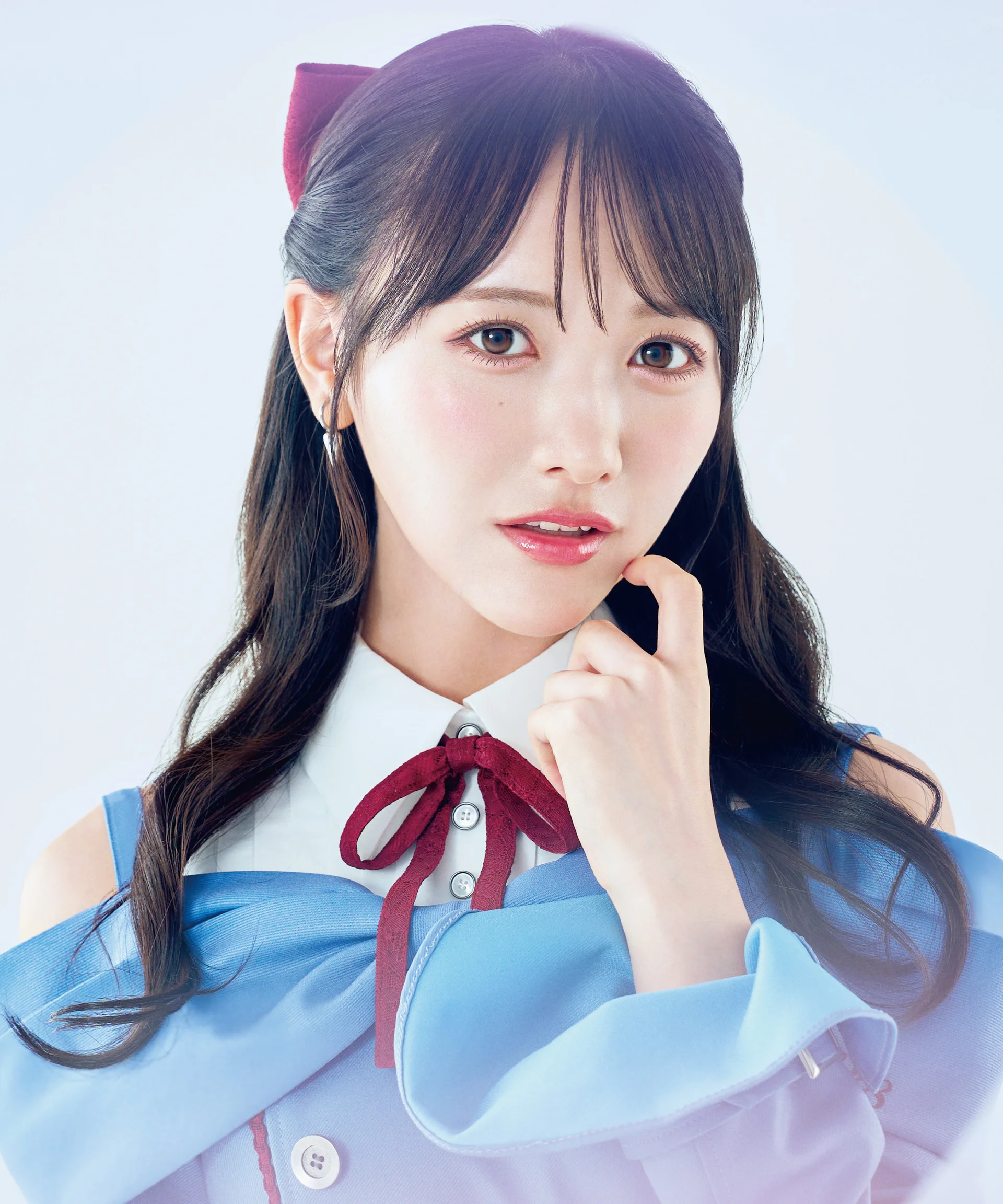 Chiho Ishida in a blue top with a red ribbon