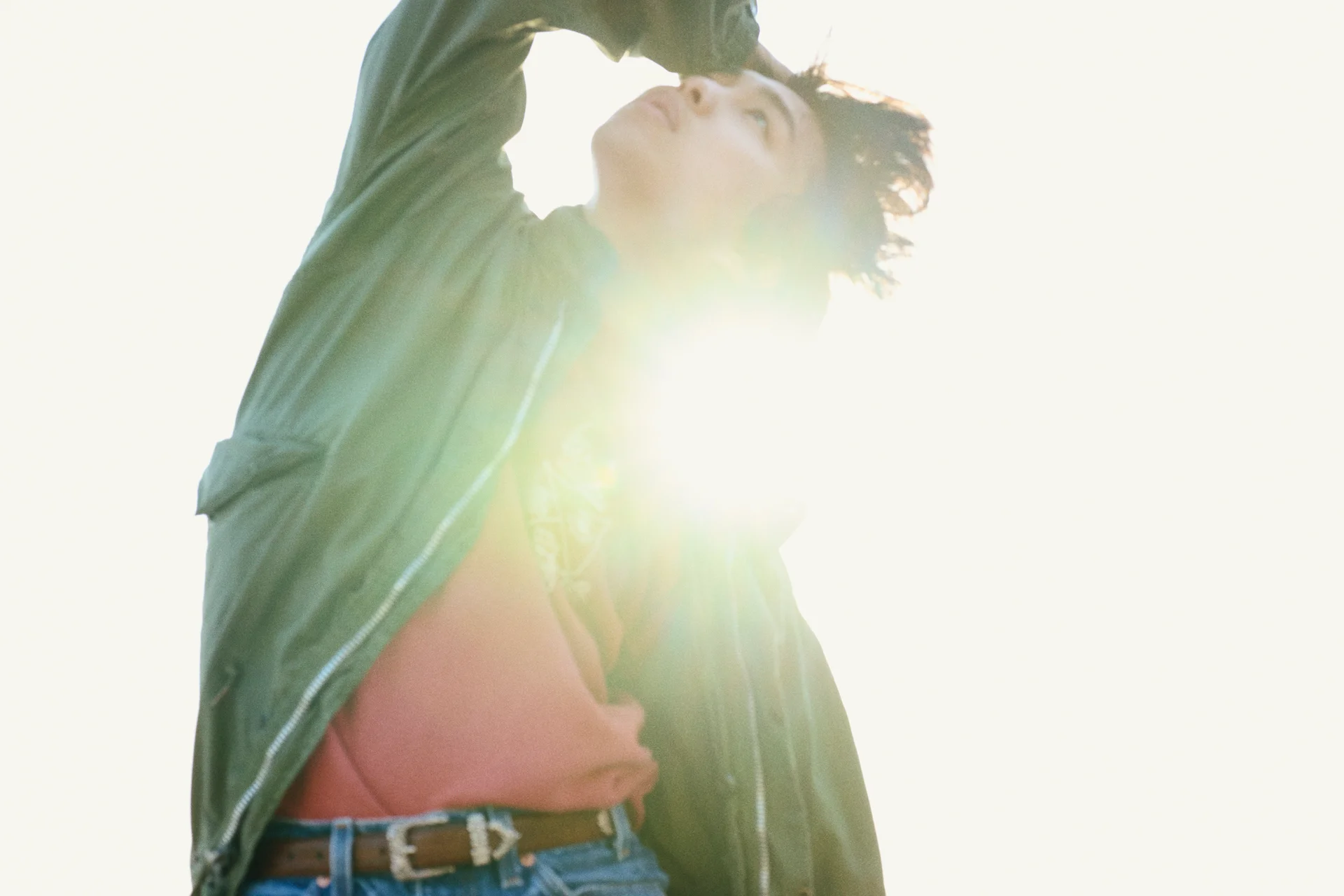 Rol3ert in casual clothing with sunlight creating lens flare
