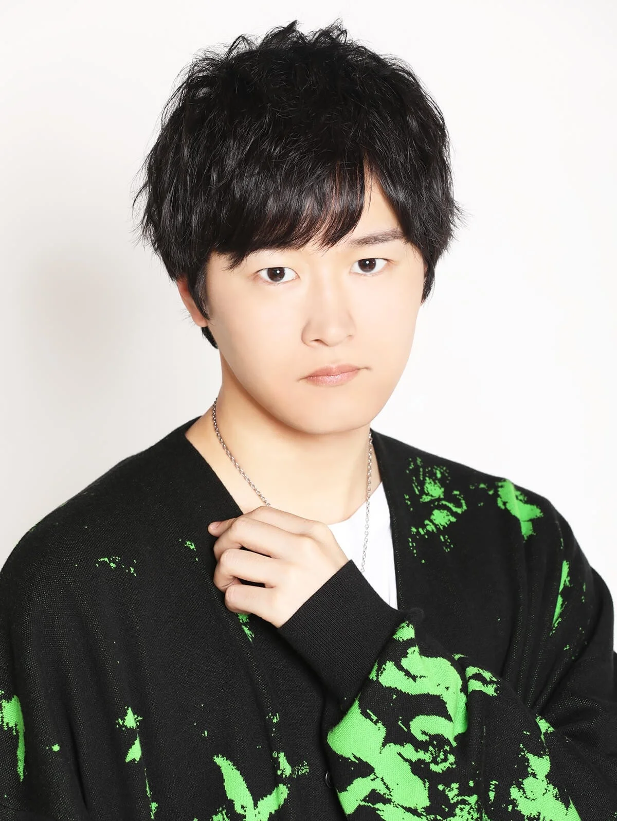 Portrait of Ryota Osaka in a patterned jacket