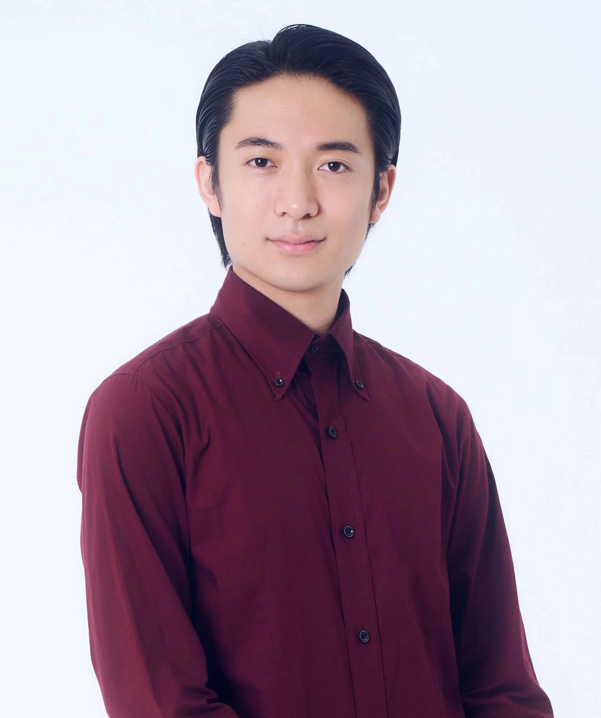 ORE Tomoda in a burgundy shirt