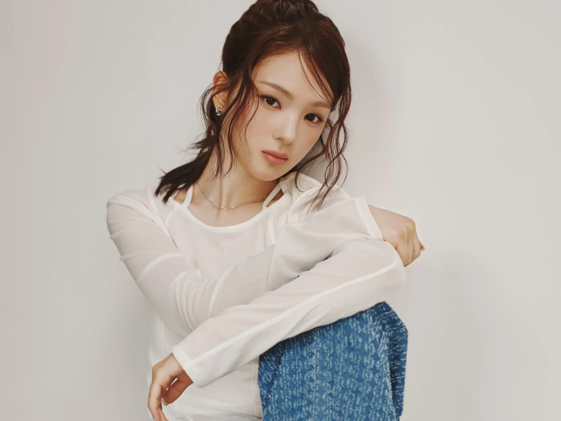 Gyubin sitting against a white background