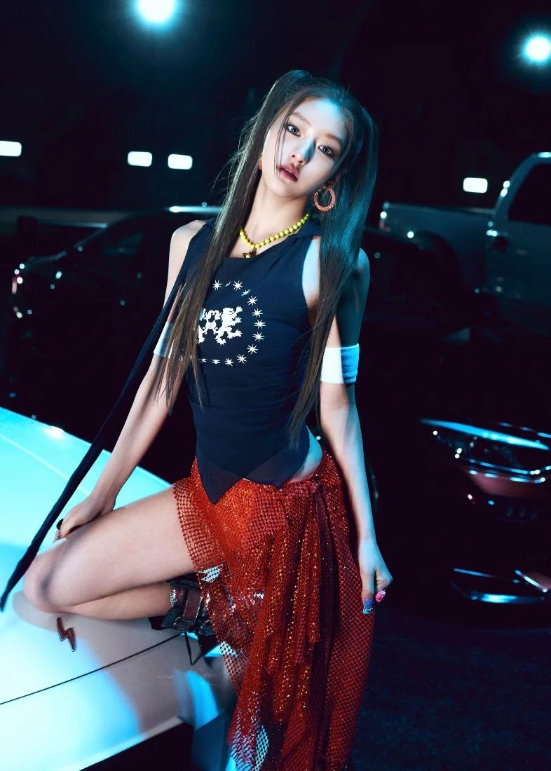 KISS OF LIFE member in a stylized outfit
