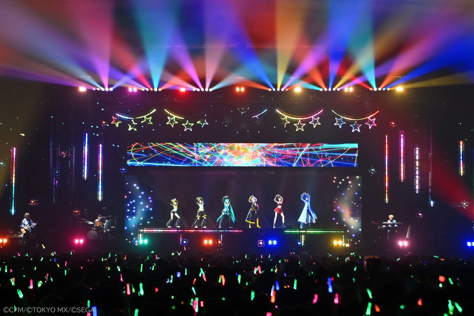 Hatsune Miku concert stage with audience glow sticks