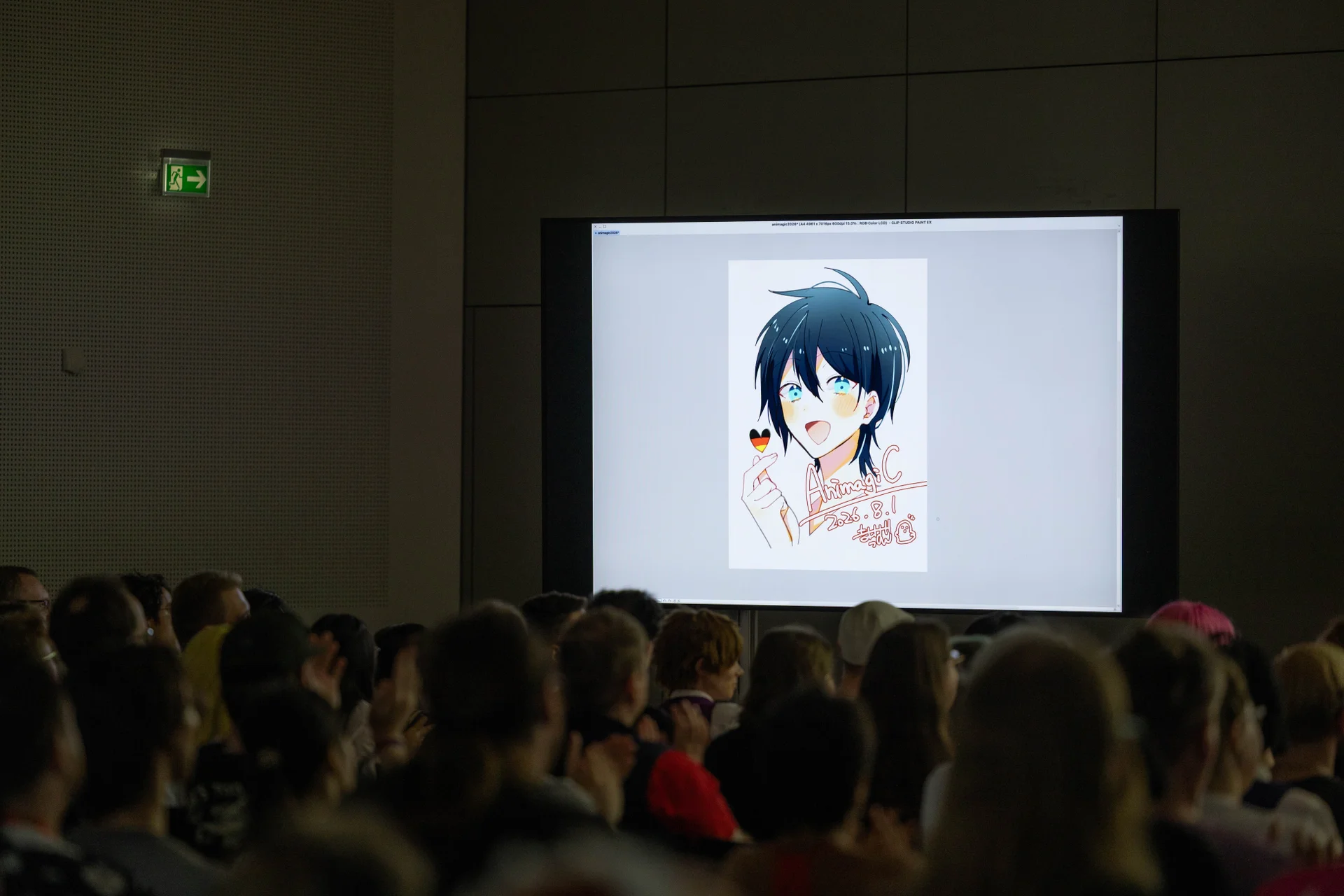 Crowd watching the anime presentation at the convention