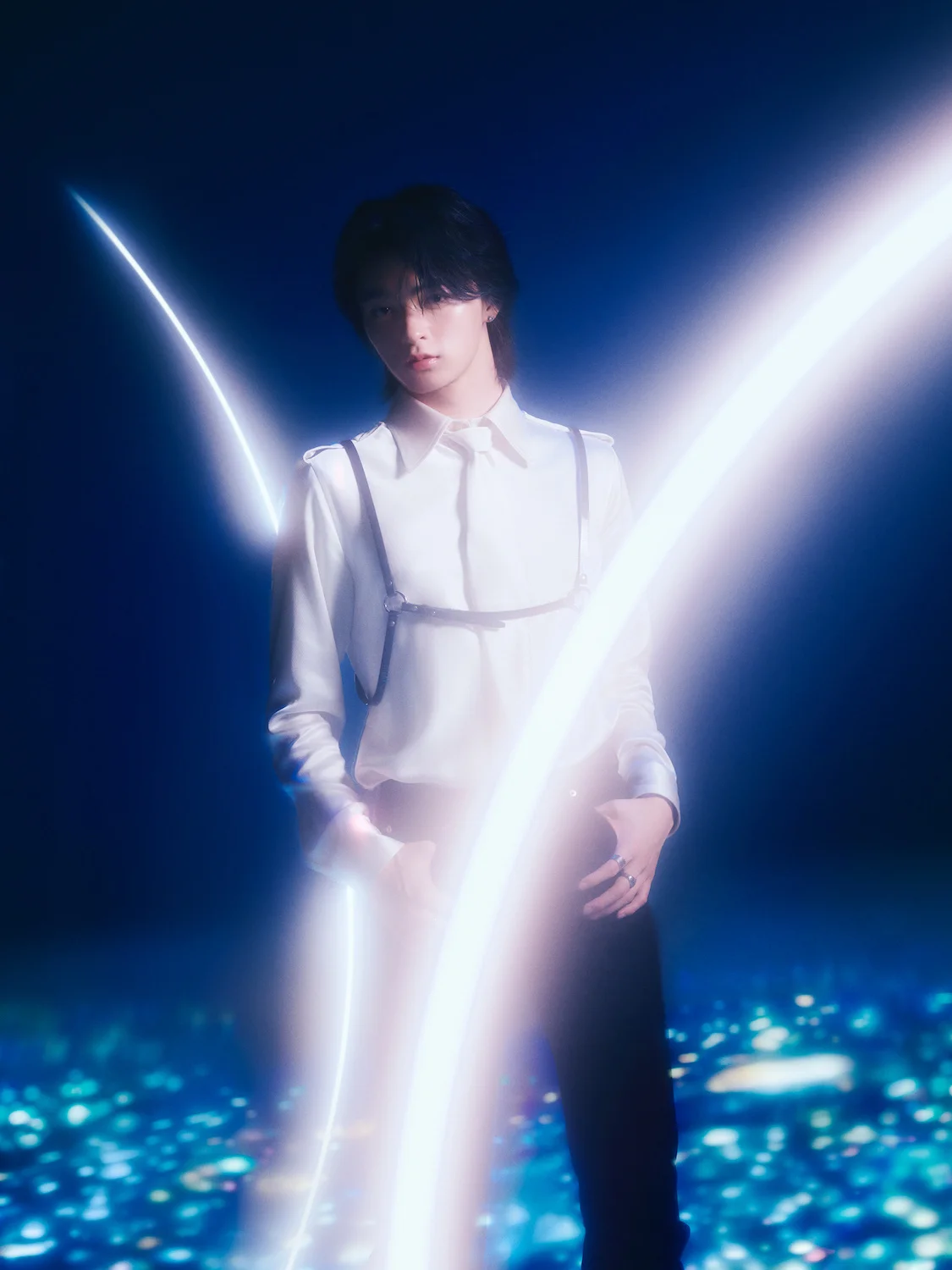 A member of STARGLOW surrounded by glowing light arcs in a dark, starry background