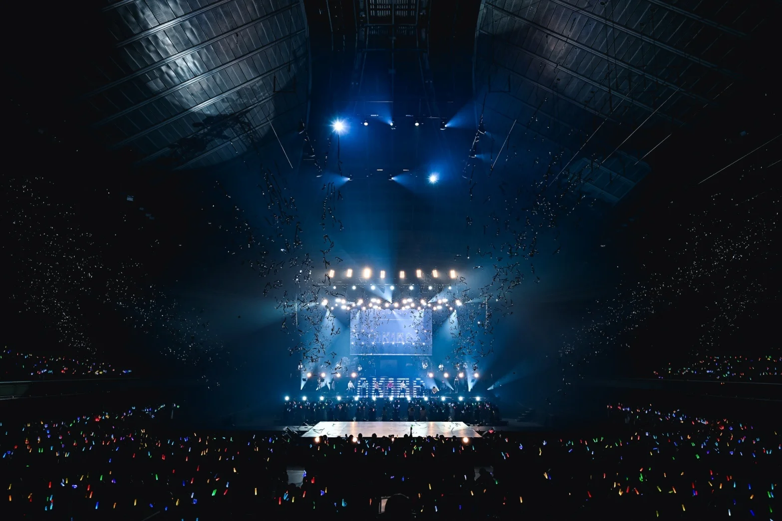 Concert stage at Tokyo Metropolitan Gymnasium lit with blue lights