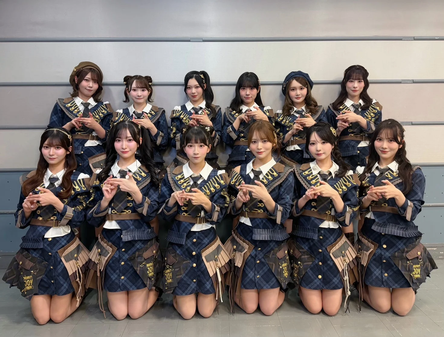 ≒JOY members in matching blue plaid outfits