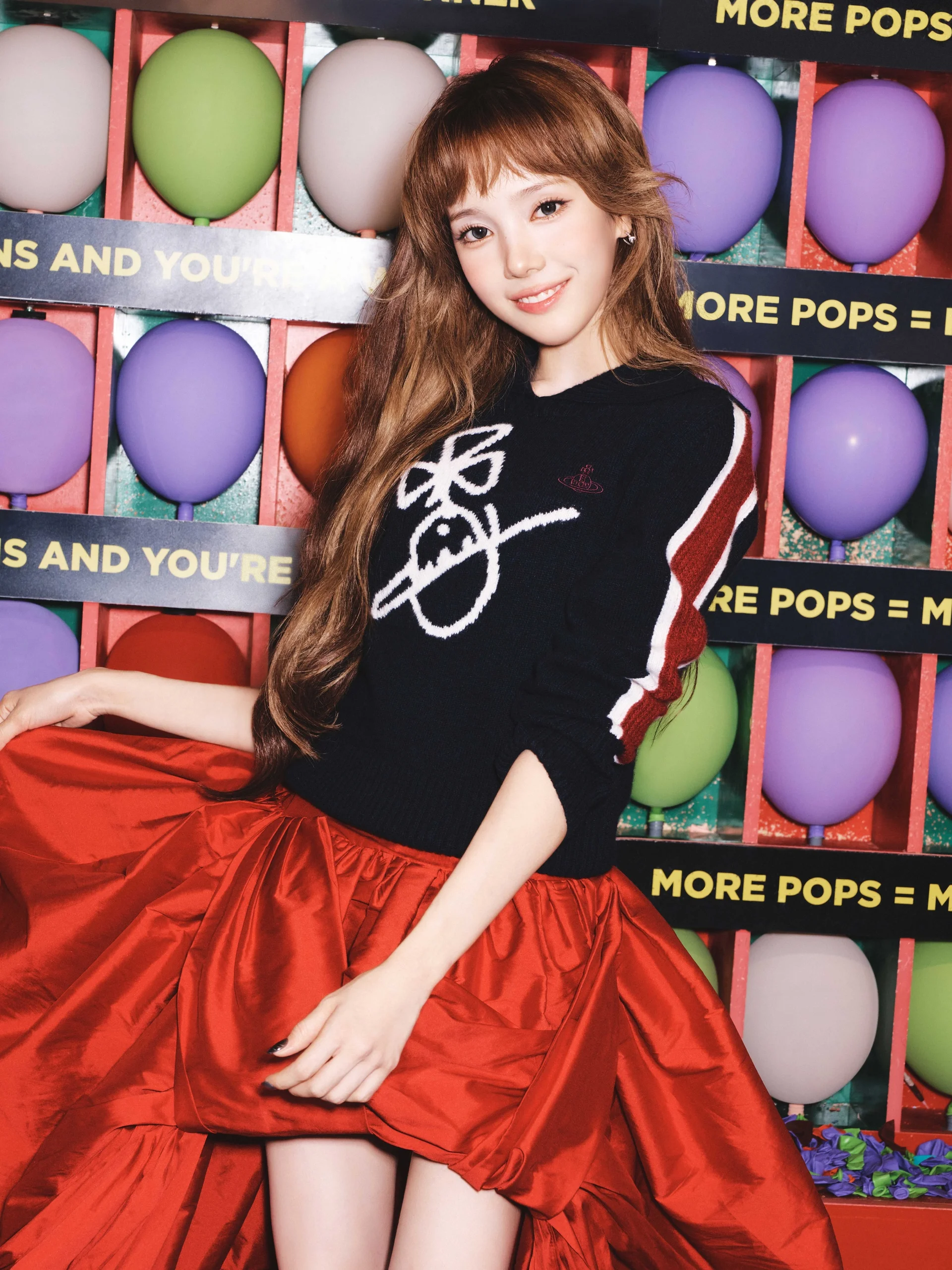 Baby DONT Cry member in front of colorful balloons